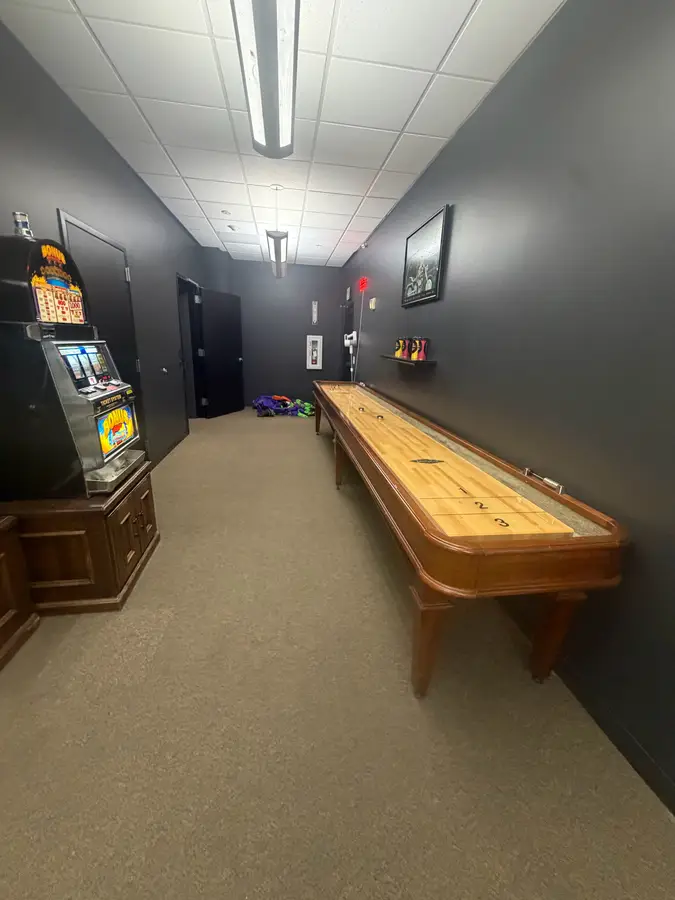 Full-length shuffleboard table